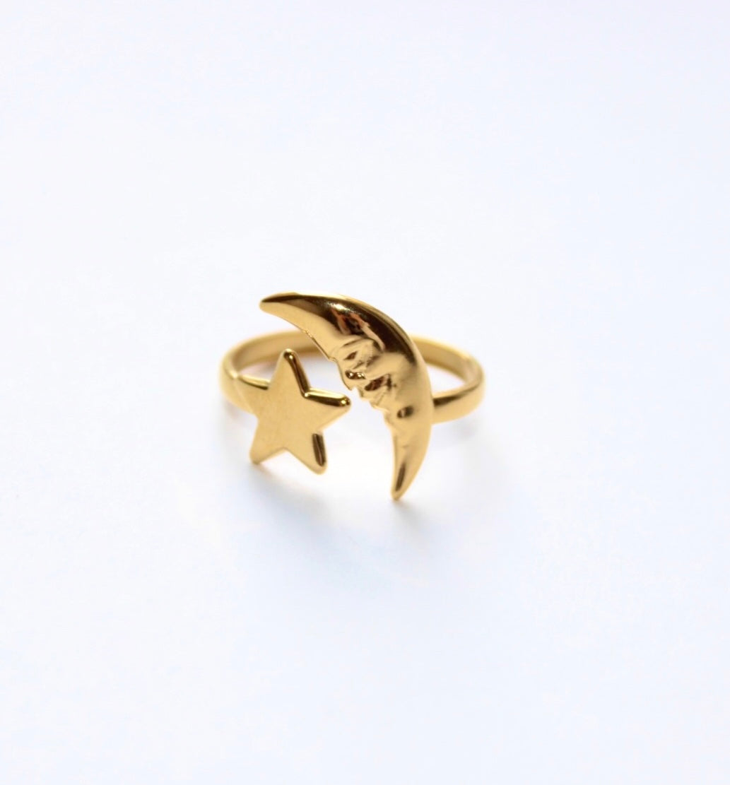 size 8 star and half crescent moon cuff thing, moon has engraving of face.