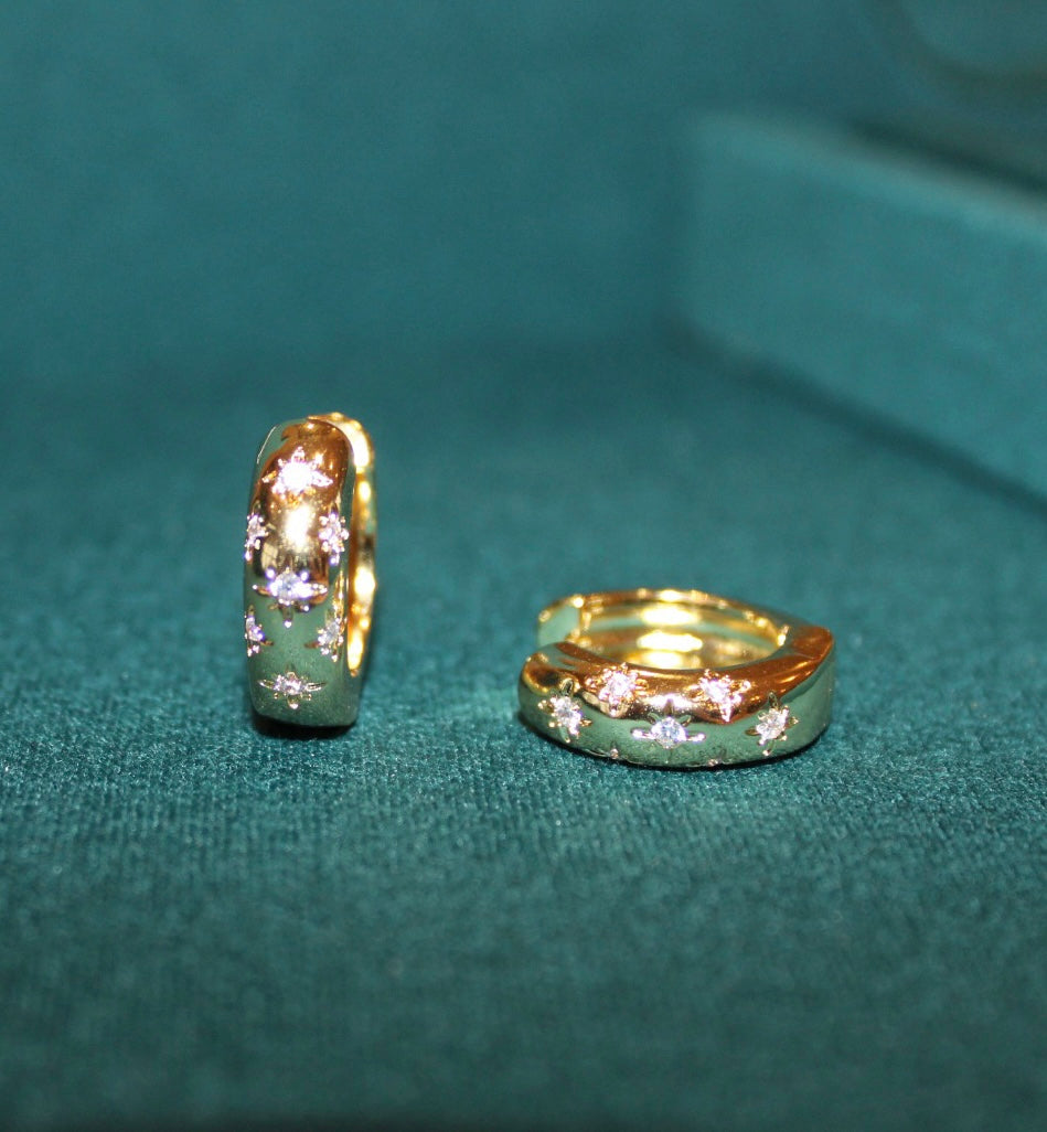 gold plated chunky earrings with star engraving and cubic zirconia stones