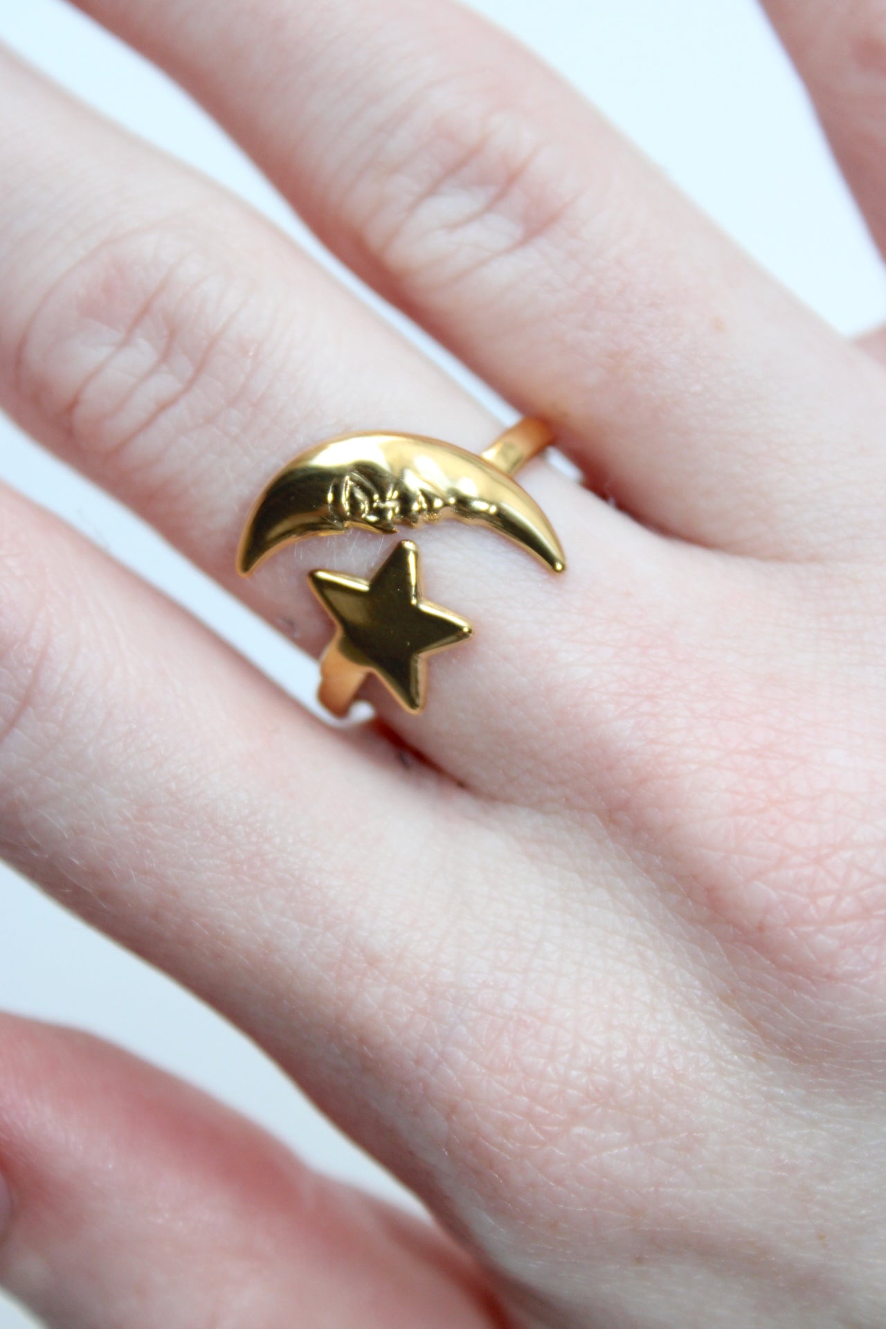 size 8 star and half crescent moon cuff thing, moon has engraving of face.
