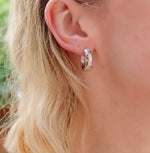 real platinum plated thick hoop earrings with star details; engraved with real cubic zirconia centres