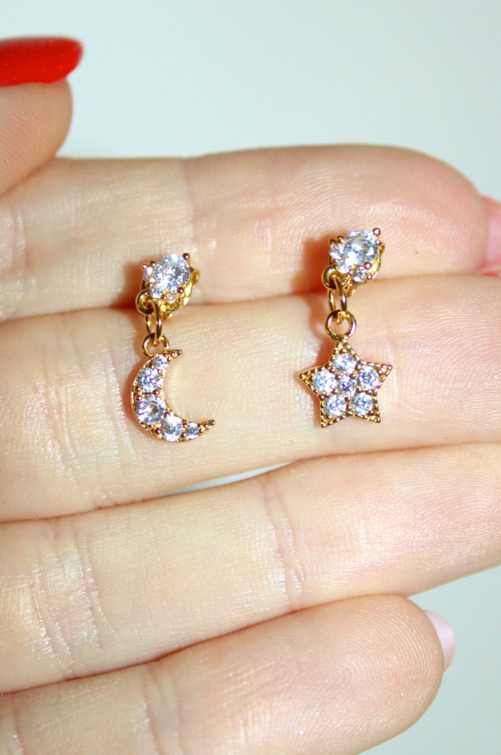 mini star and moon stud dangle earring with real cubic zirconias.