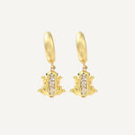 Gold frog-shaped earrings with diamond accents on a white background