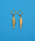 gold stainless steel hoop earring with stainless steel fish engraved pendant 