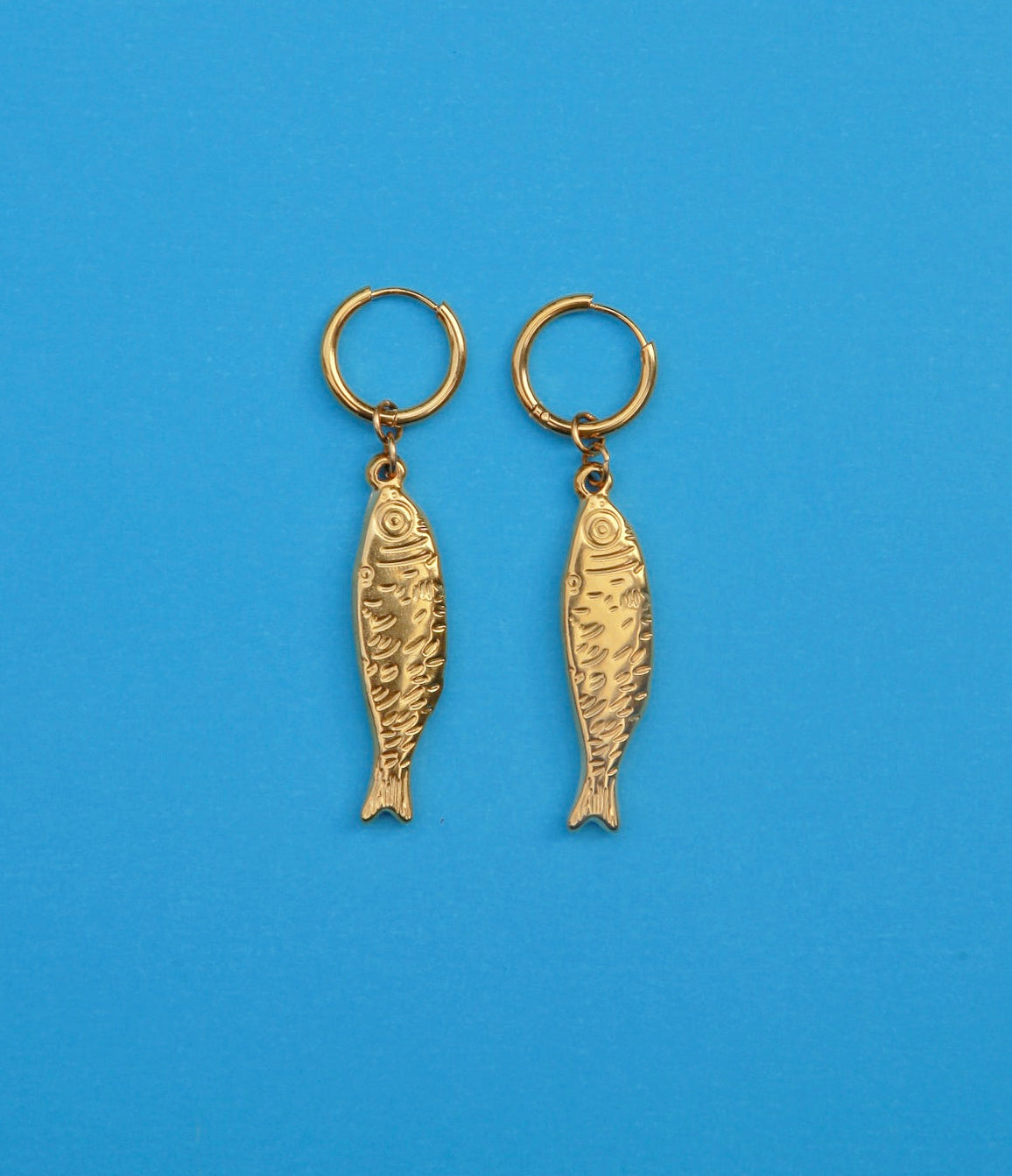 gold stainless steel hoop earring with stainless steel fish engraved pendant 