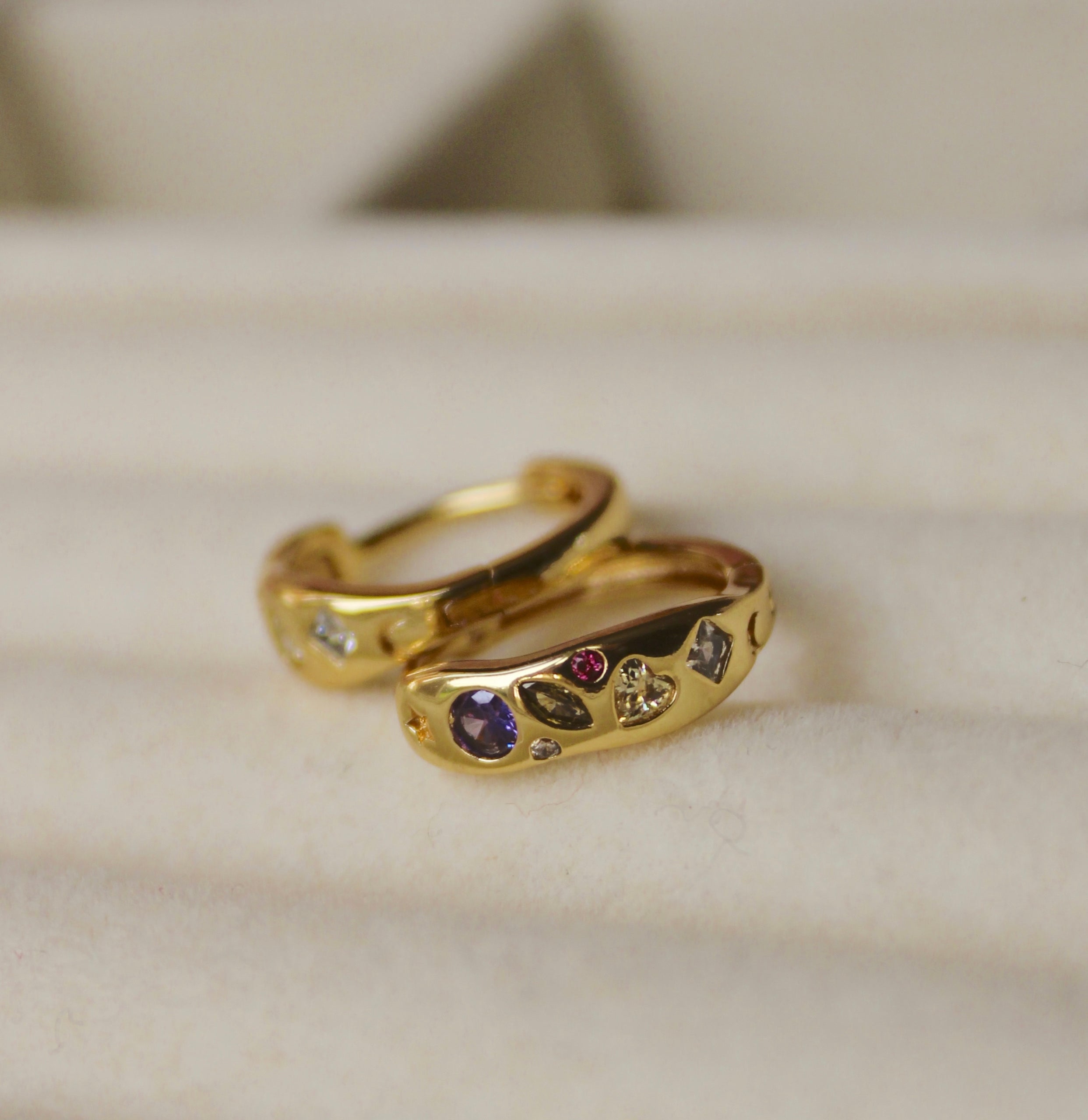 gold plated Huggies with mixed shaped cubic zirconias, circles, heart, diamond, crescent moon, star