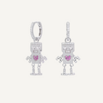 Pair of robot-shaped earrings with pink heart details on a white background, 925 sterling silver with rhodium plating, real cubic zirconia