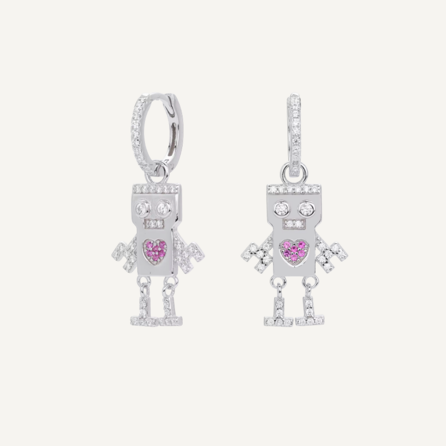 Pair of robot-shaped earrings with pink heart details on a white background, 925 sterling silver with rhodium plating, real cubic zirconia