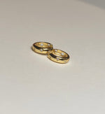 gold plated hoop earring with stars and cubic zirconia stone