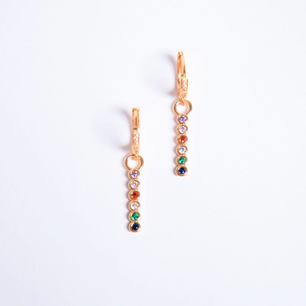 real 18k gold plated earring huggies with colourful rainbow cubic zirconia on a downward fall 